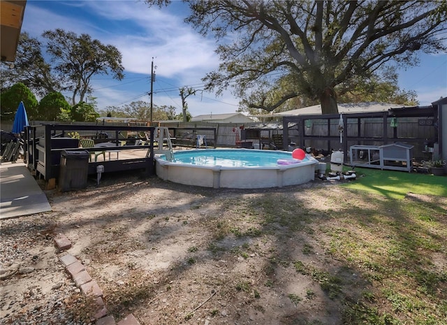 view of pool with a yard