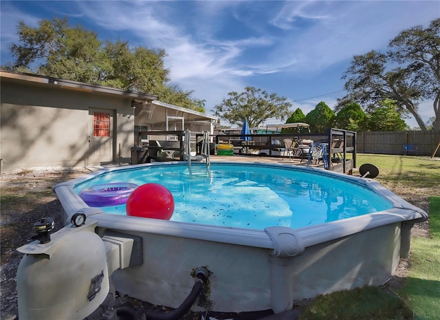 view of swimming pool featuring a patio and a sunroom