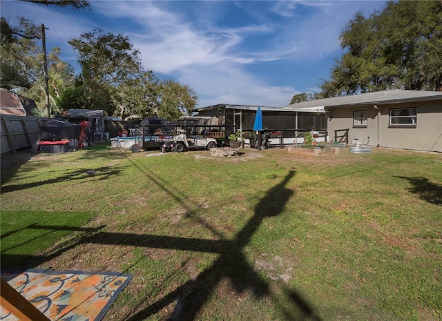 view of yard with a sunroom