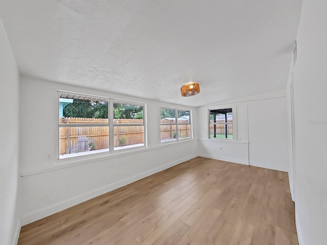 spare room featuring light hardwood / wood-style floors