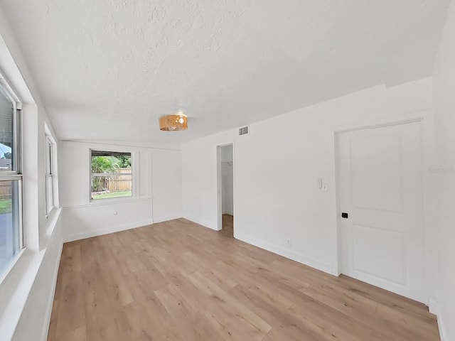 unfurnished room featuring light hardwood / wood-style flooring