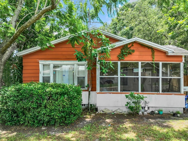 view of front of property featuring a sunroom