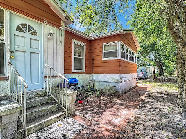 property entrance with a patio area