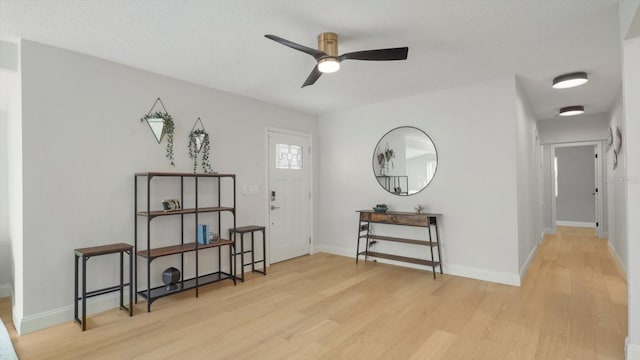 interior space featuring light hardwood / wood-style floors and ceiling fan