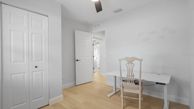 office space with light hardwood / wood-style flooring and ceiling fan