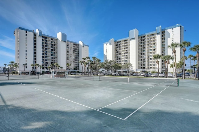 view of tennis court with fence