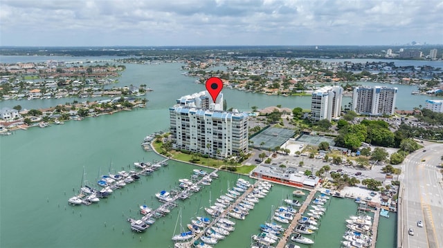 birds eye view of property featuring a view of city and a water view