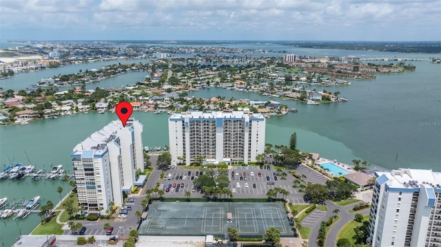 birds eye view of property with a water view and a view of city