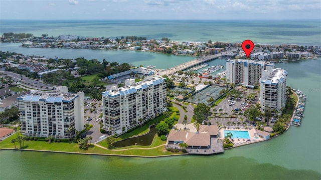 birds eye view of property with a water view and a city view