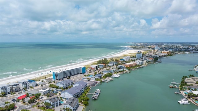 birds eye view of property featuring a water view and a view of the beach