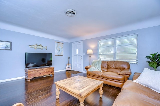 living room with dark hardwood / wood-style floors