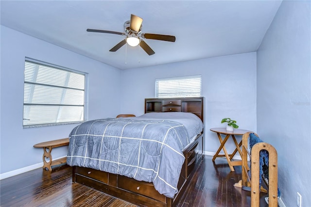 bedroom featuring ceiling fan and dark wood-type flooring