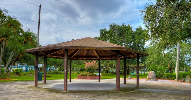 view of property's community with a gazebo and a lawn