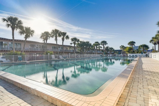 view of pool featuring fence