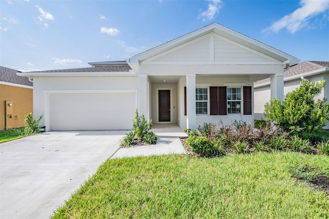 view of front facade featuring a front yard and a garage