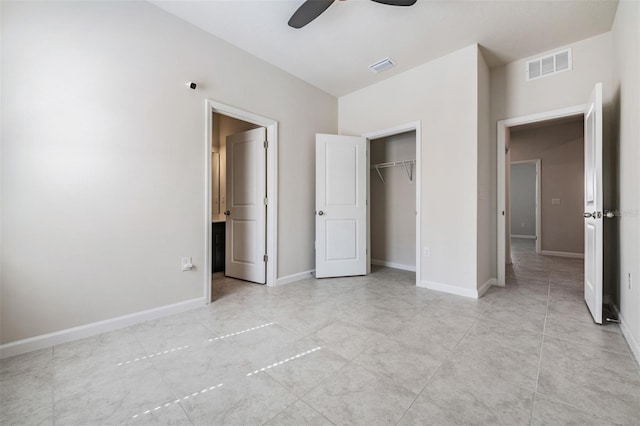 unfurnished bedroom featuring light tile patterned floors, ceiling fan, and a closet