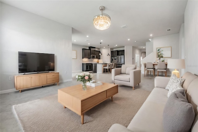 living room featuring a notable chandelier