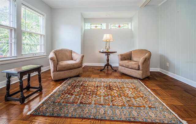 living area with dark parquet floors