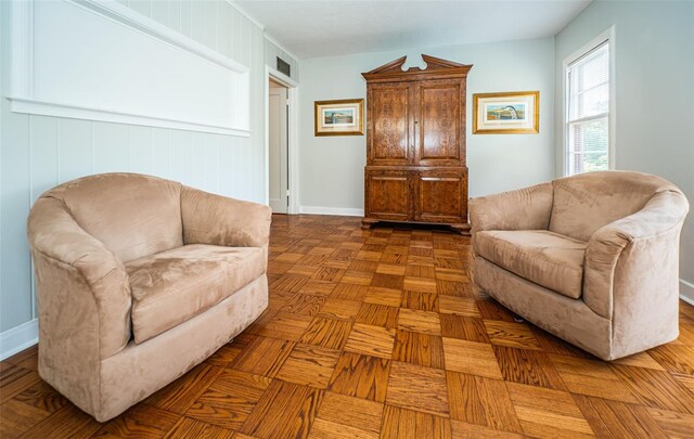 living room featuring parquet floors