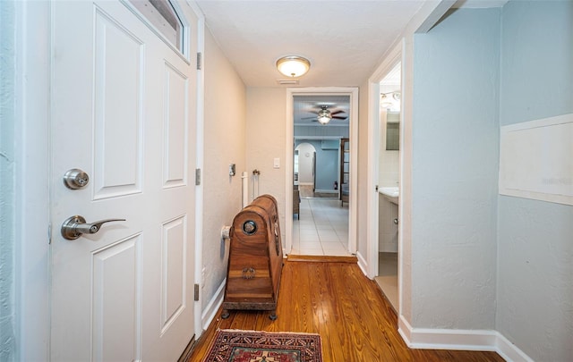 hall with hardwood / wood-style flooring