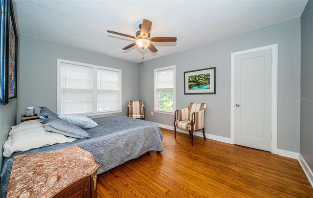 bedroom featuring ceiling fan and hardwood / wood-style floors