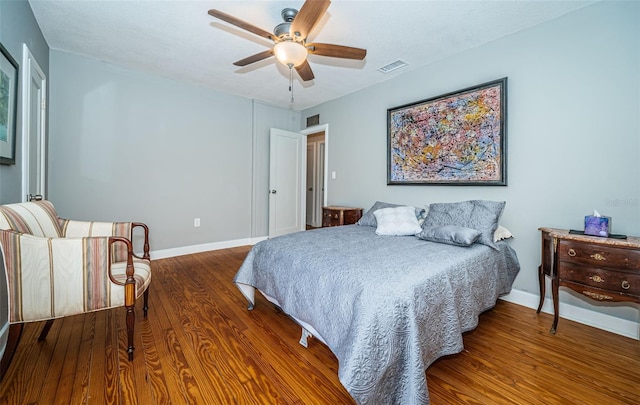 bedroom with hardwood / wood-style flooring and ceiling fan