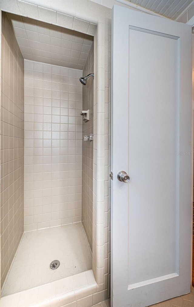 bathroom with a tile shower