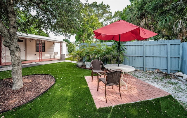 view of yard with a patio and fence