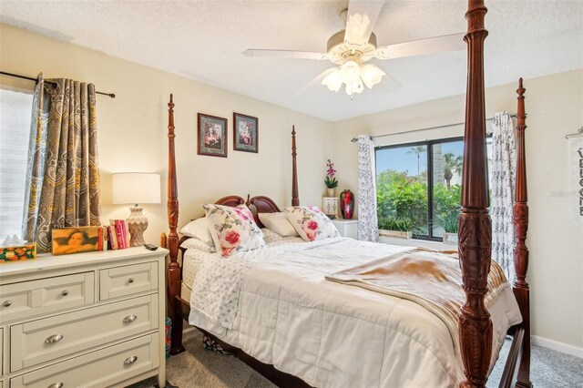 bedroom with a ceiling fan, light colored carpet, a textured ceiling, and baseboards