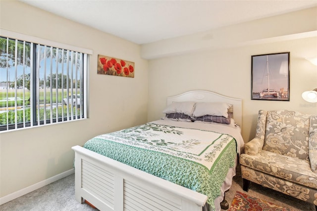 bedroom with carpet and baseboards