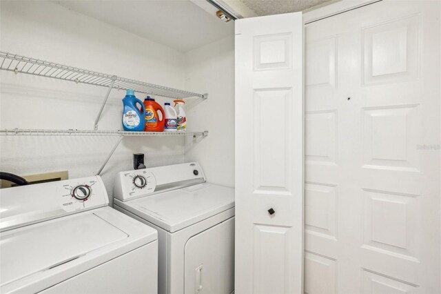 laundry room with washer and dryer