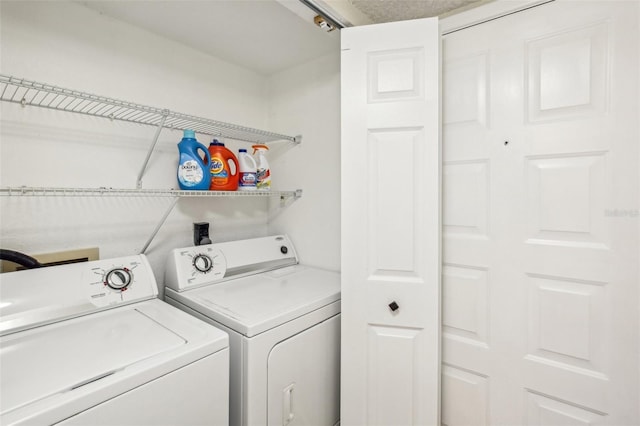 washroom featuring laundry area and washer and dryer