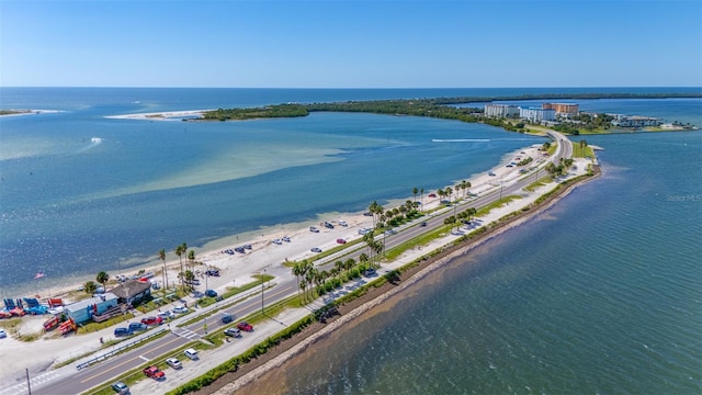 birds eye view of property featuring a view of the beach and a water view