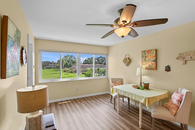 dining room featuring ceiling fan and wood-type flooring