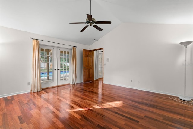 empty room featuring hardwood / wood-style flooring, ceiling fan, lofted ceiling, and french doors