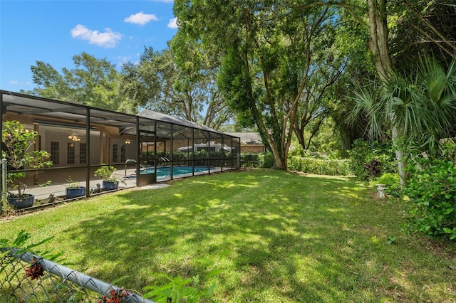 view of yard featuring a patio area and a lanai