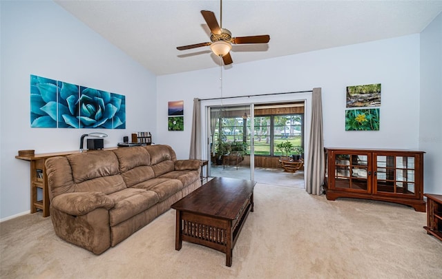 carpeted living room featuring ceiling fan and lofted ceiling