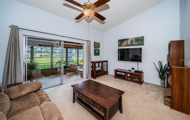 living room featuring ceiling fan, light carpet, and high vaulted ceiling