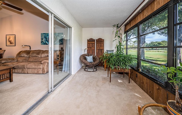 sunroom / solarium with ceiling fan