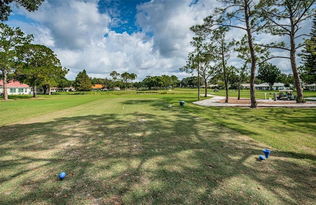 view of home's community featuring a lawn