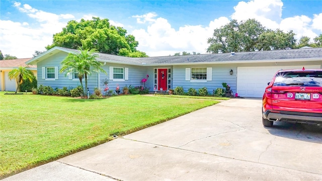 single story home featuring a front lawn, driveway, and an attached garage