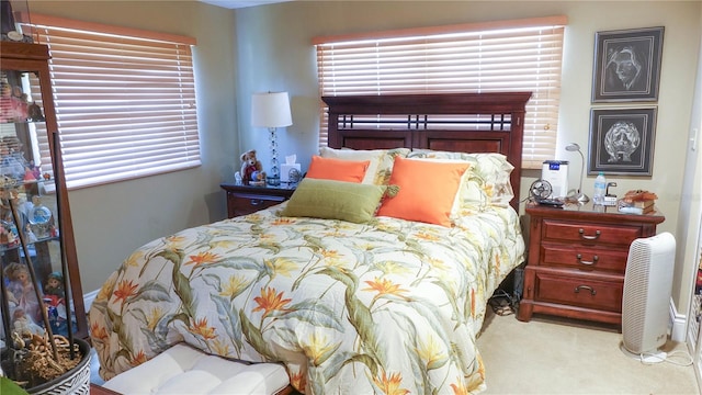 bedroom featuring light carpet