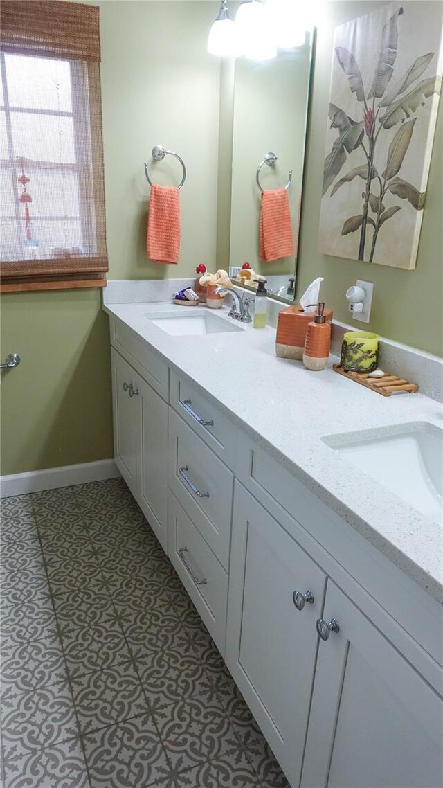 bathroom with tile patterned floors and vanity