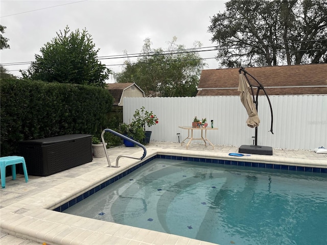 view of pool with a patio area and a fenced backyard