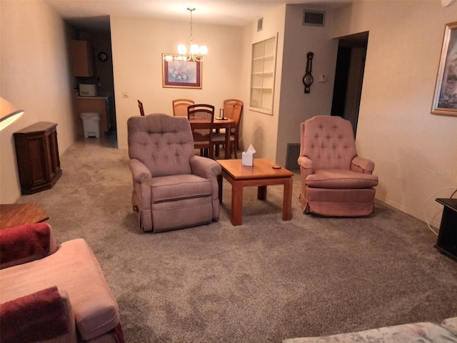 carpeted living room with a chandelier