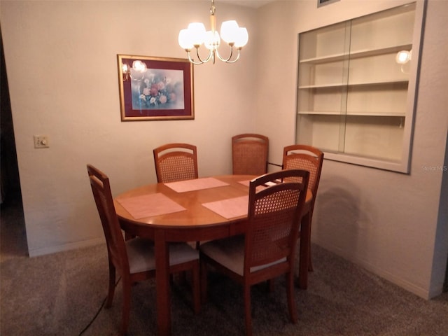 dining room featuring carpet floors and a chandelier