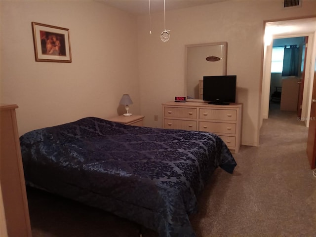 bedroom featuring light carpet