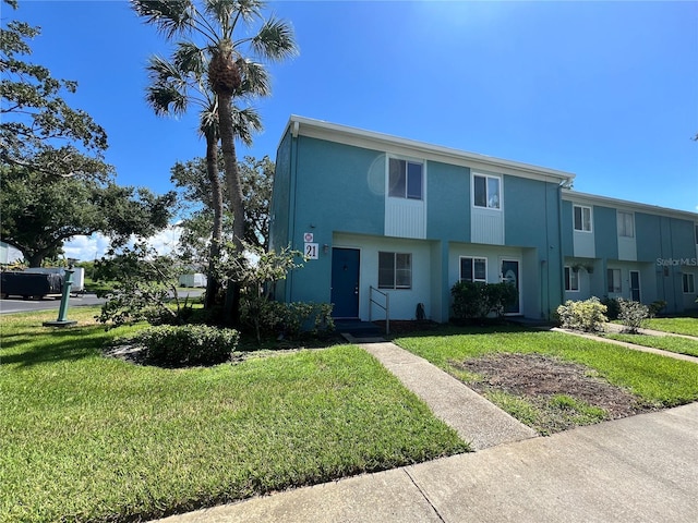 view of front of home with a front lawn