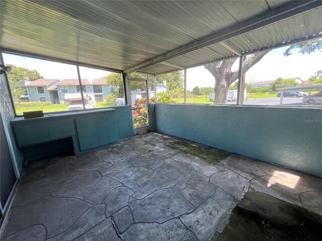 unfurnished sunroom with a residential view