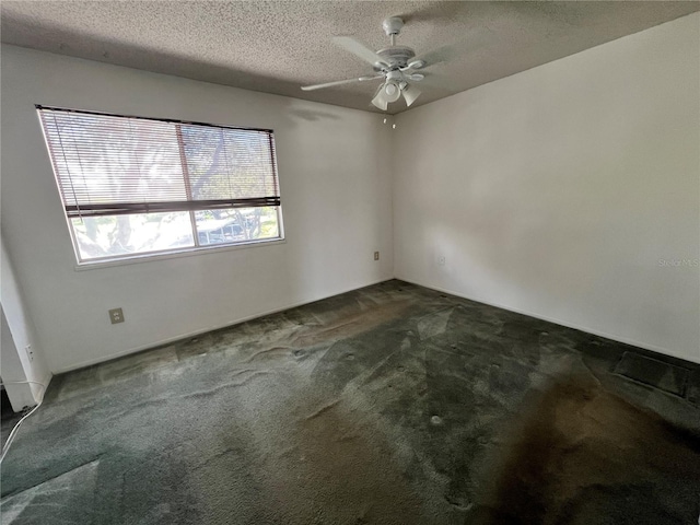 182 114th Ter NE Unit 182, Saint Petersburg, FL 33716 - carpeted empty room featuring a textured ceiling and ceiling fan